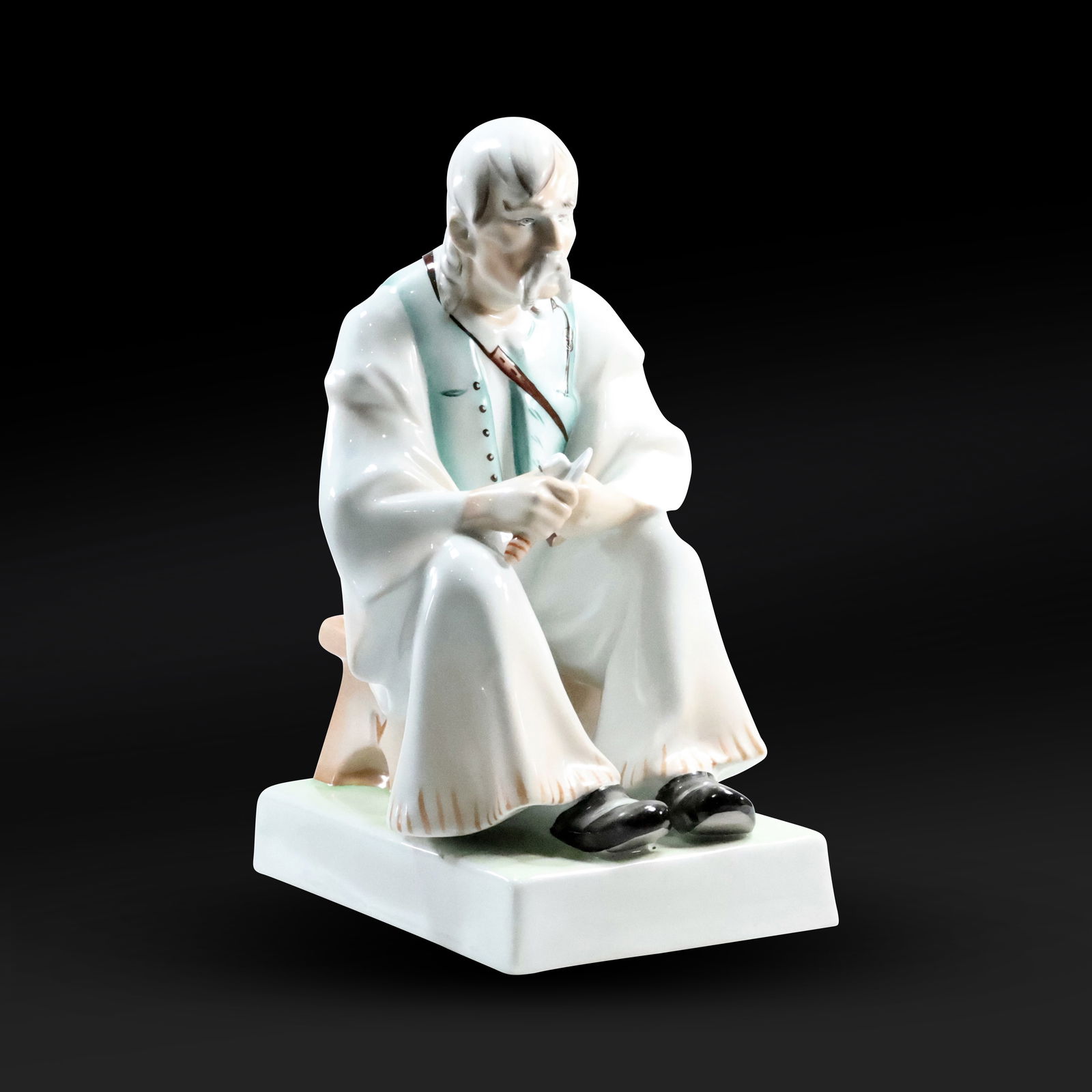 Zsolnay Pecs Hand-Painted Porcelain Sculpture of a Seated Man Whittling (1 of 20)