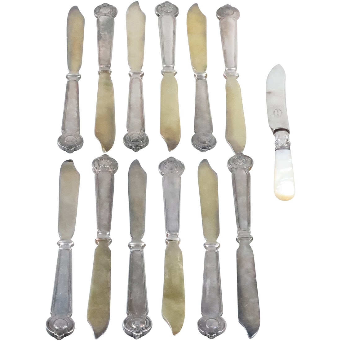 Set 12 Antique Silver Plate Knives with Insignia plus an odd Mother-of-Pearl Handle: Set 12 Antique Silver Plate Knives with Insignia plus an odd Mother-of-Pearl Handle. size: 12x (7.25 x .5), 1x (6.25x .5)