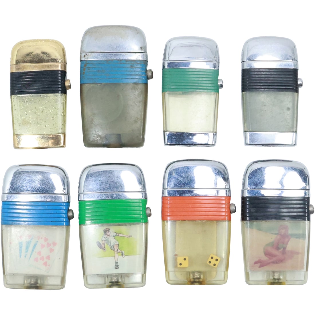 8 Assorted Vintage SCRIPTO Cigarette Lighters 1950s Novelty: Coin, Nude, Dice, Playing Cards,: 8 Assorted Vintage SCRIPTO Cigarette Lighters 1950s Novelty: Coin, Nude, Dice, Playing Cards, Tennis, Gold Sparkle, all have a color band. Sizes range 2 7/8 in. x 1 5/8 in. to 2 1/2 in. x 1 3/8 in.