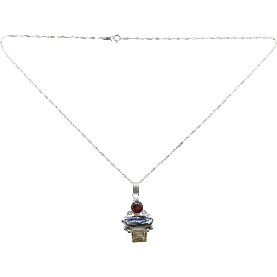 .925 Sterling Abalone, Garnet and Citrine Pendant Necklace on .925 Sterling 20 in. chain: .925 Sterling Abalone, Garnet and Citrine Pendant 1 3/4 in. x 1 in. Necklace on .925 Sterling 20 in. chain.
