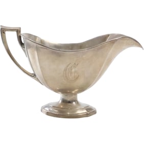Sterling Silver Creamer weighs 95.3 grams, 4 in. x 6 3/4 in. x 3 3/8 in.