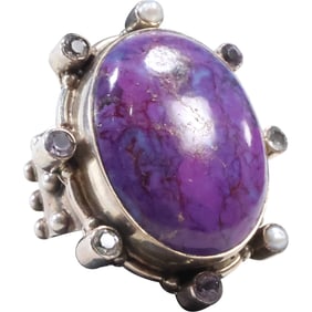 Sterling Silver Ring with Purple Mojave Turquoise Stone in a Brutalist Setting.