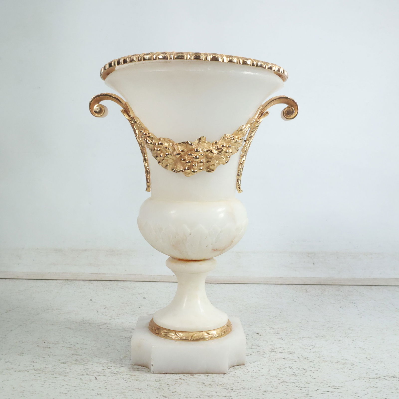 18.5 inches tall French White Alabaster Urn with Gilt Bronze Mounts and Trim: 18.5 inches tall French White Alabaster Urn with Gilt Bronze Mounts and Trim. size: 18.5 x 13.5 x 12 between shelves