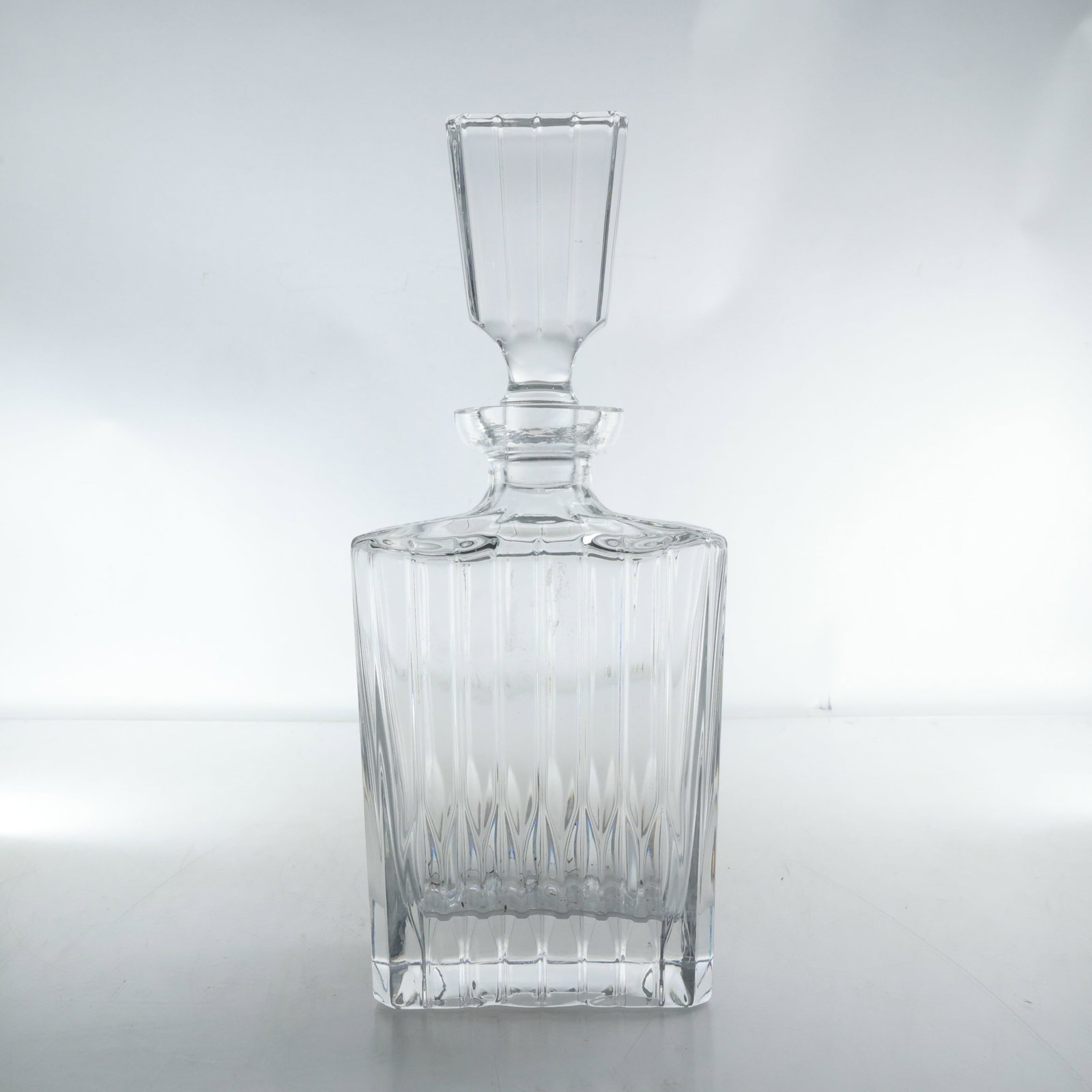 Antique Heavy German Mikasa Crystal Liquor Decanter 11.75 in. height x 5 in. wide: antique heavy German Mikasa crystal liquor decanter features a classic and elegant design. The decanter is crafted from high-quality crystal, showcasing vertical etched lines that add texture and visu