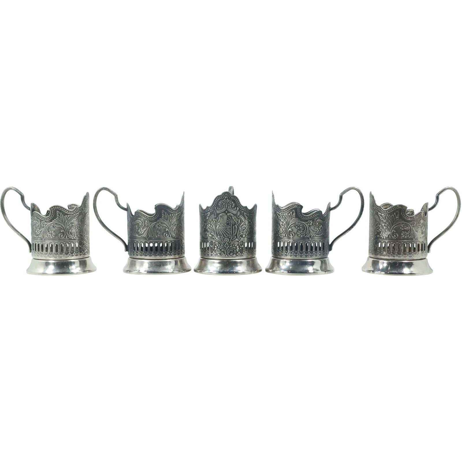 USSR Soviet Mid-Century Melchior Podstakanniks: Set of Five Glass Holders: This set of five vintage Melchior podstakanniks, or glass holders, originates from the Soviet Union, reflecting the utilitarian design and craftsmanship typical of the mid-20th century. Each holder fe
