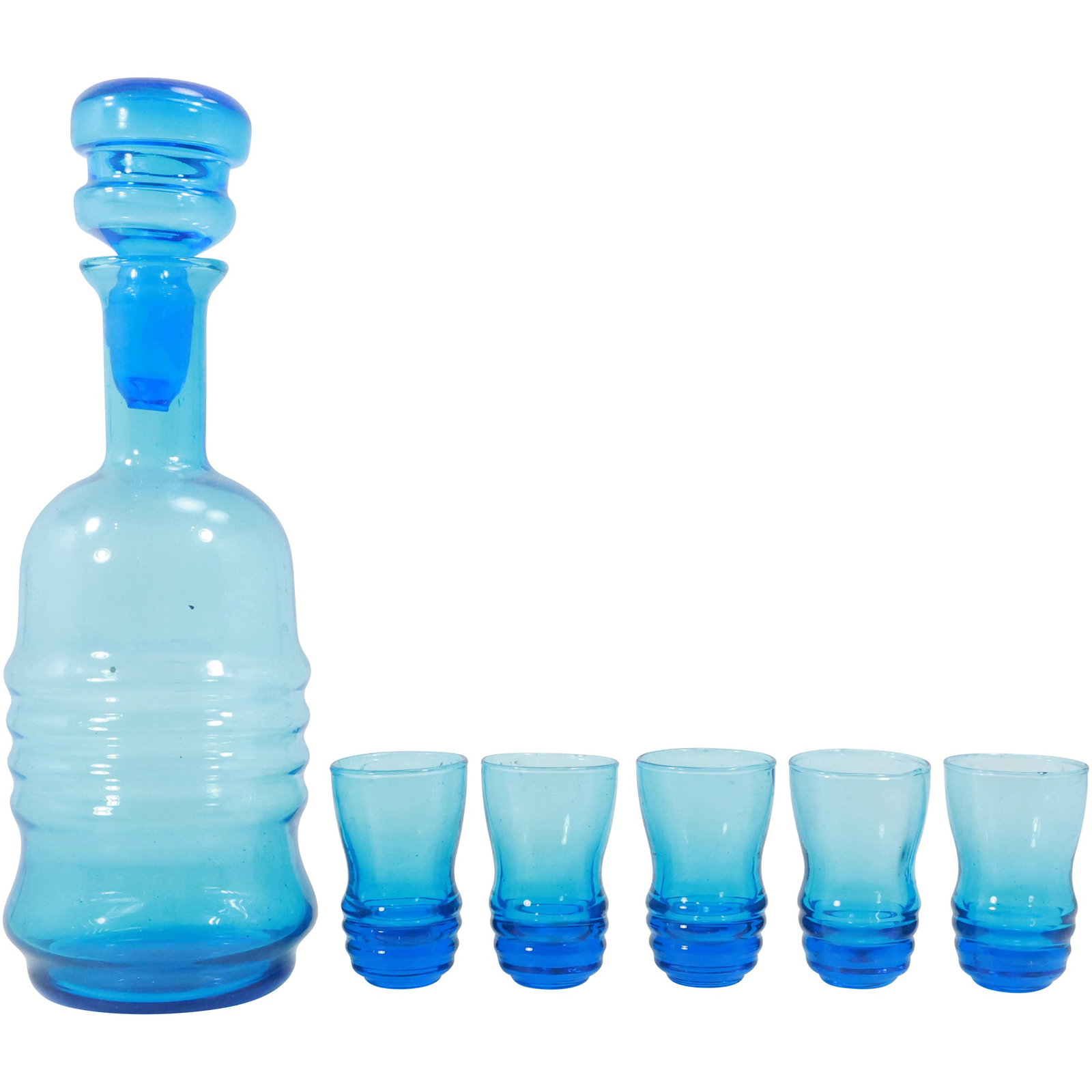 Vintage Mid-Century Modern Blue Ribbed Decanter and Shot Glass Set: This vintage mid-century modern set features a striking blue glass decanter with matching shot glasses, each adorned with a distinctive ribbed design. The decanter boasts a smooth, curvaceous form wit