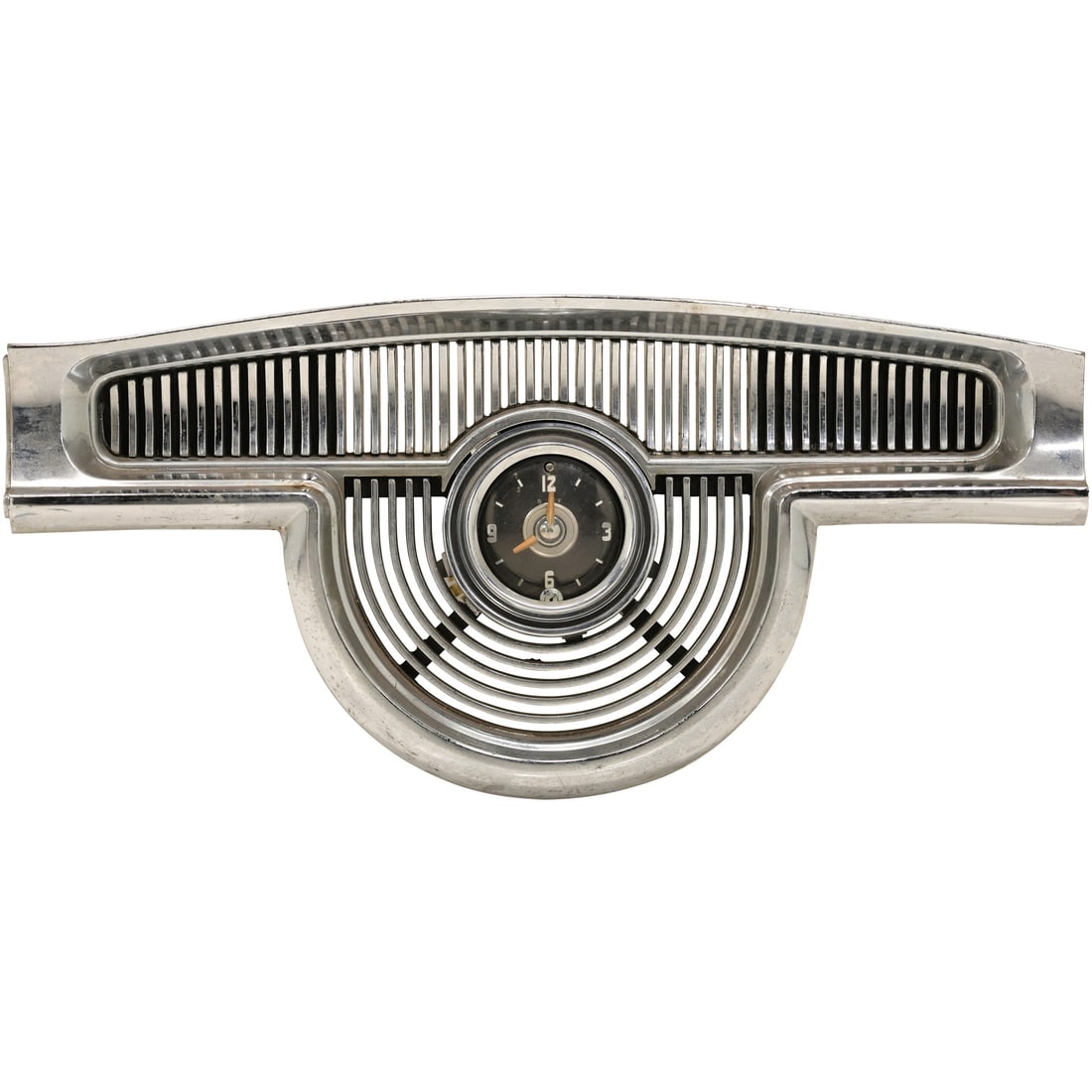 1954 Oldsmobile 88 Chrome Speaker Cover with Integrated Clock Emblem: This classic piece from a 1954 Oldsmobile 88 features the original chrome speaker cover with an integrated clock emblem at its center. The beautifully designed grill highlights the mid-century automot