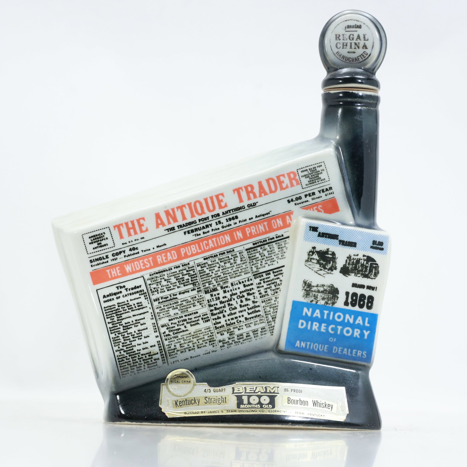"Antique Trader" Collector's Liquor Bottle: "Antique Trader" Collector's Liquor Bottle; size 10.75 in. x 8.25 **Important Pick-Up Information: Lots 1-100 are located at our Auction Gallery at 174 Glasco Turnpike, Saugerties, NY 12477. Pick-up f