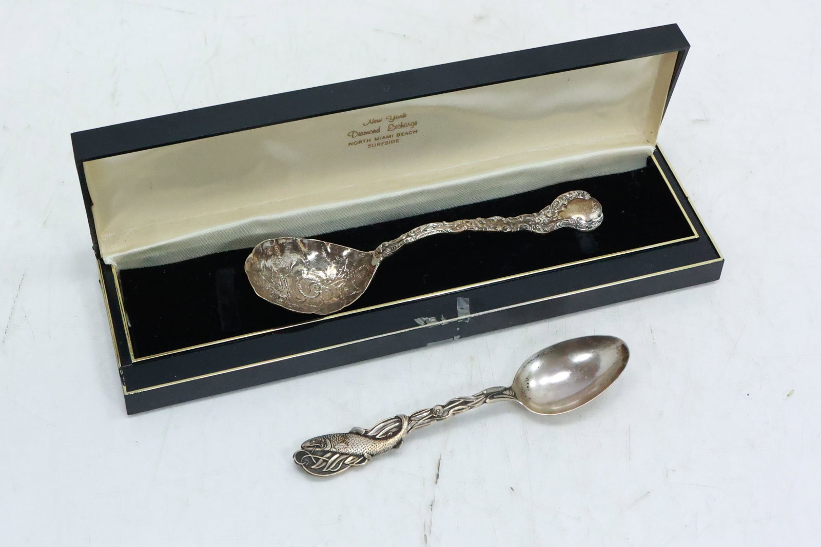 2 Sterling Silver Spoons, Fancy and Fish, 43.7 grams: 2 Sterling Silver Spoons, Fancy and Fish, 43.7 grams; sizes 6.5 in. **Important Pick-Up Information: Lots 1-100 are located at our Auction Gallery at 174 Glasco Turnpike, Saugerties, NY 12477. Pick-up