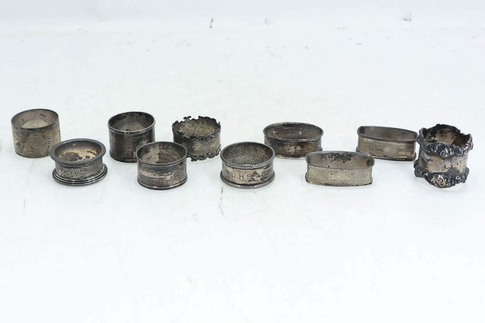 10 Napkin Rings: 6 Sterling 115.4 grams; 2 Sterling not marked 33 grams; 2 Hall Marked 73.89 grams (1 of 17)