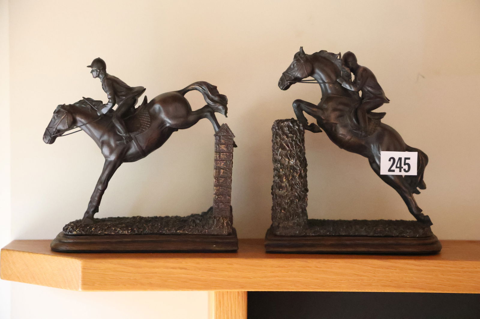 Horse Jumping Figural Bookends 9 in. x 7 in.: Horse Jumping Figural Bookends 9 in. x 7 in. Made of hard composition with a bronzed patina. **Important Pick-Up Information: Lots 1-100 are located at our Auction Gallery at 174 Glasco Turnpike, Saug
