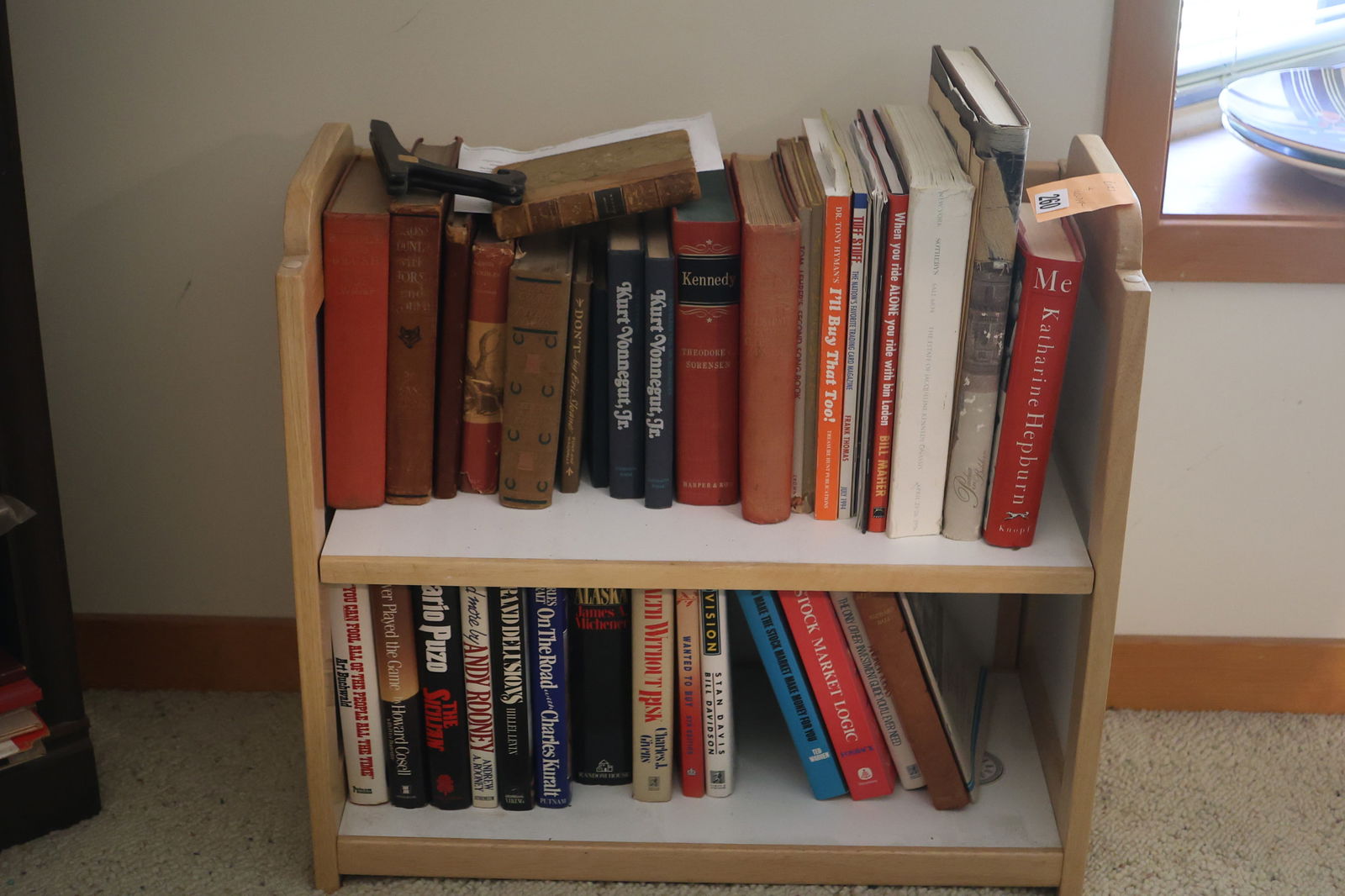 Assorted Books on a Small Book Shelf Holder (1 of 3)