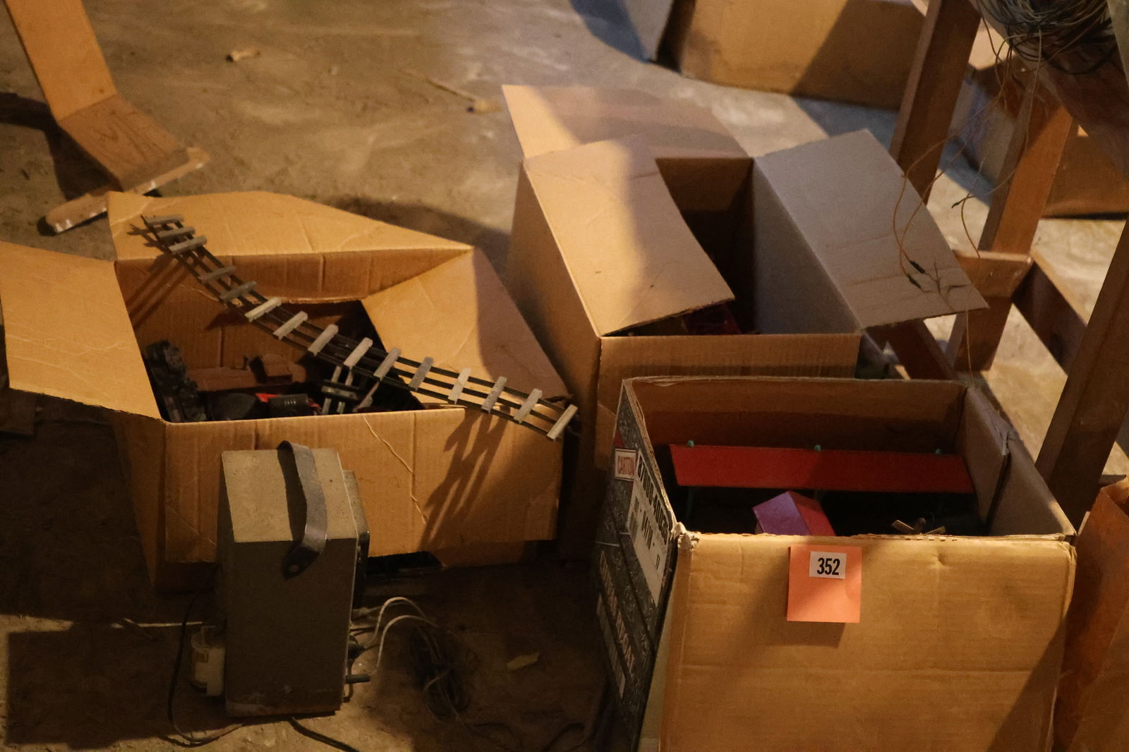 Basement: Grouping of LIONEL TRAINS, 2 locomotives, passenger rail cars, track, transformer (1 of 11)