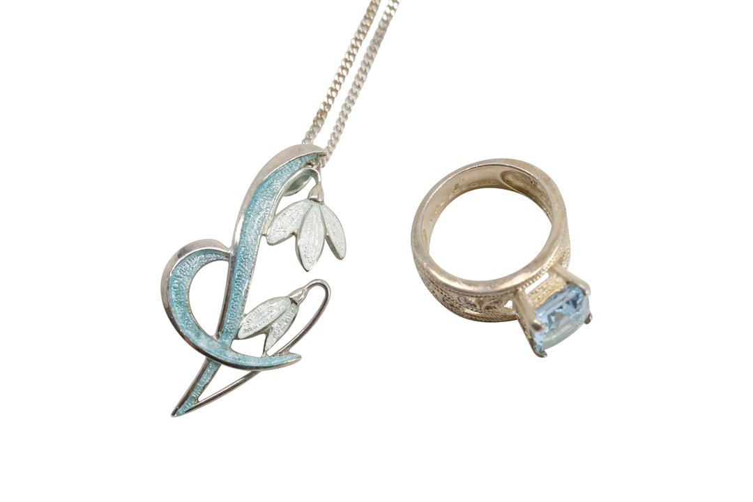.925 Sterling Silver Enameled Lily Pendant Necklace on .925 Sterling F.B.M. Binder 20 in. Chain and: .925 Sterling Silver Enameled Lily Pendant 1 1/2 in.1 in, Necklace on .925 Sterling F.B.M. Binder 20 in. Chain and .925 Sterling Silver R.J. with Blue Topaz Ring Size 5, 3/4 in. x 3/8 in.