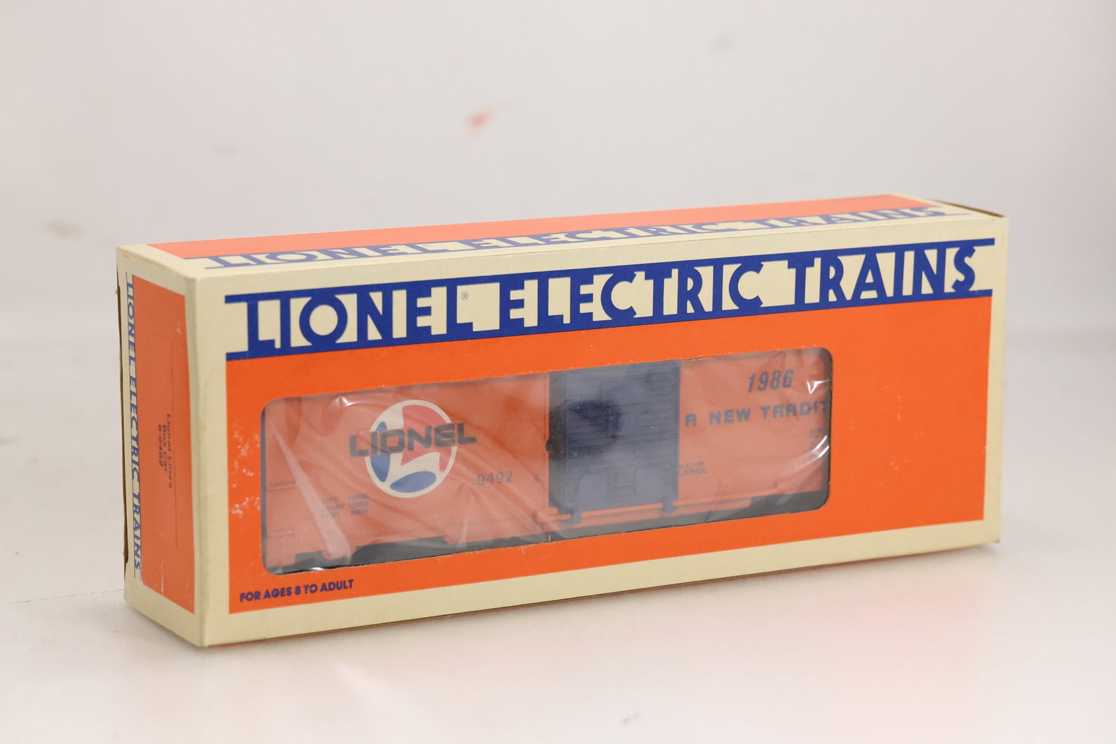 1986 Lionel Lines Boxcar #6-9492 - 'A New Tradition' Design: 1986 Lionel Lines Boxcar #6-9492 - 'A New Tradition' Design Size: 11.5 x 4.5 x2.5