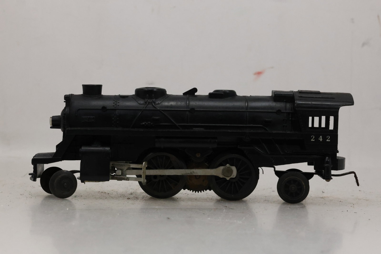Classic Black Model Lionel 242 Steam Locomotive: Classic Black Model Lionel 242 Steam Locomotive often referred to as a Scout locomotive, was produced between 1962 and 1966 Size: 9 x 13