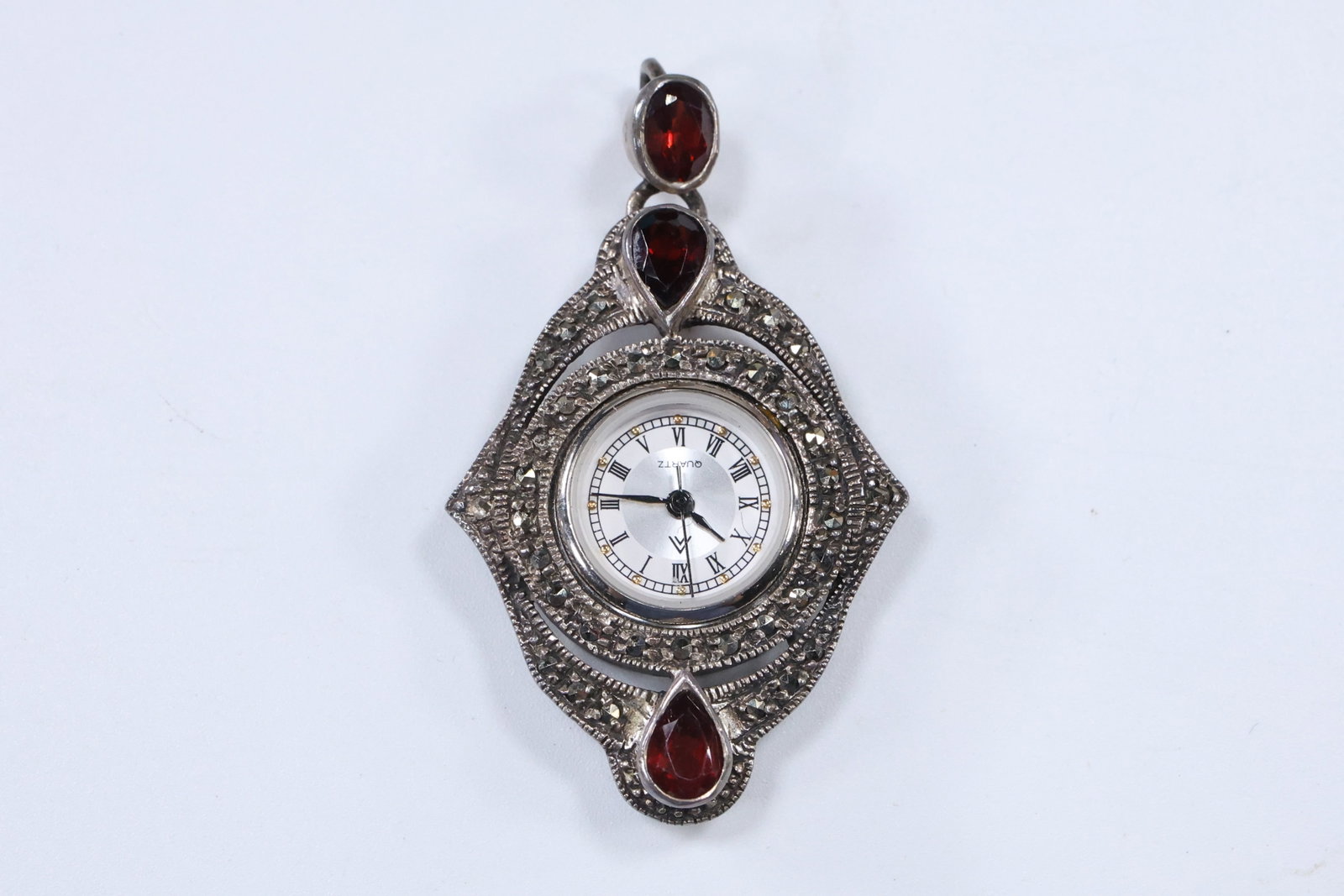.925 Sterling Silver with Marcasites and Garnets W TM Pendant Clock [Nurse's Watch]: .925 Sterling Silver with Marcasites and Garnets W TM Pendant Clock [Nurse's Watch], size 2 1/4 in. x 1 1/4 in.