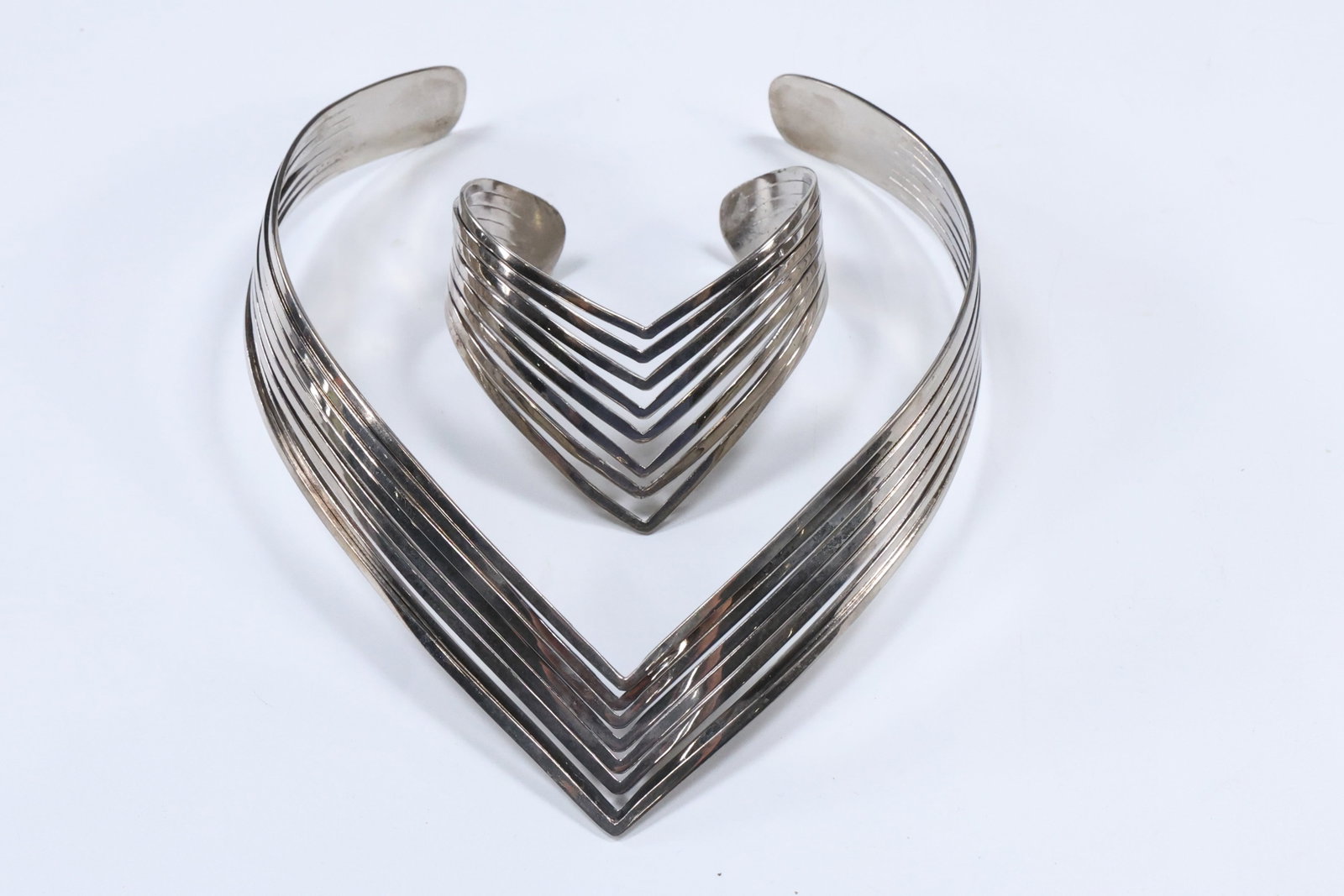 1980s/90s Vintage "V" Choker / Hard Collar and "V" Cuff Bracelet: 1980s/90s Vintage "V" Choker / Hard Collar 6 1/4 in. x 5 1/4 in. x 3/4 in. and "V" Cuff Bracelet 2 in. x 2 7/8 in. x 1 5/8 in.