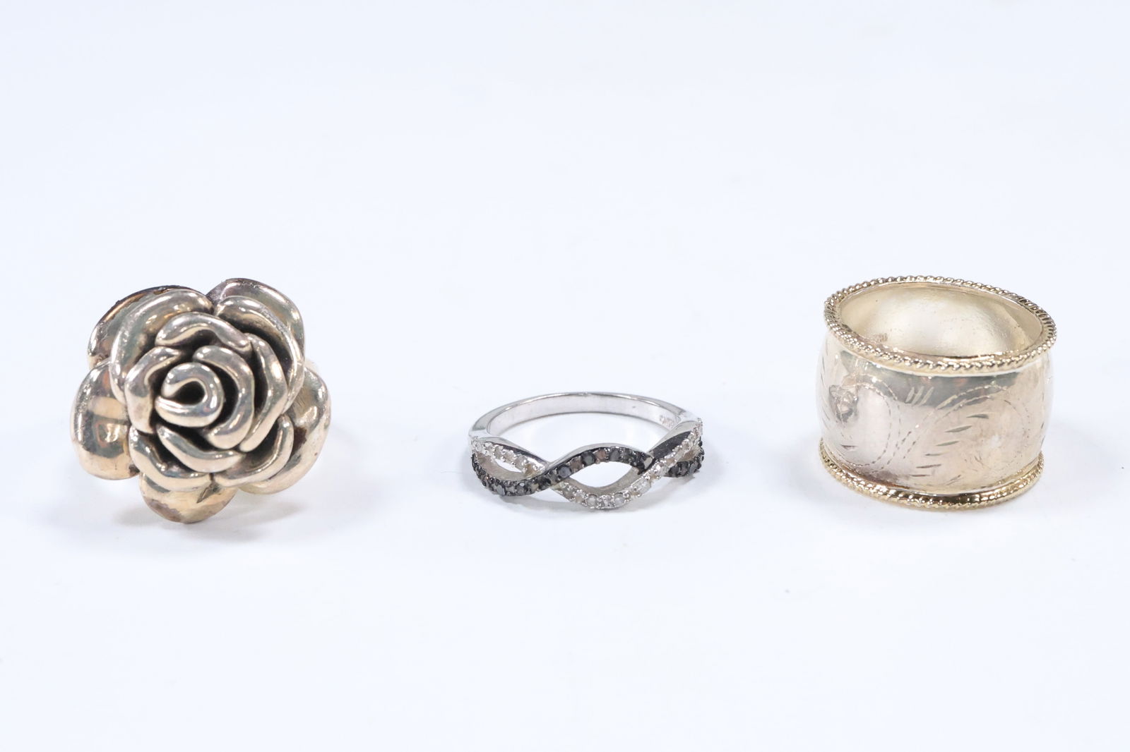 3 Assorted .925 Sterling Silver Rings: ATI .925 Rose Ring Size 7; .925 Wide Band Size 7.75; (1 of 16)