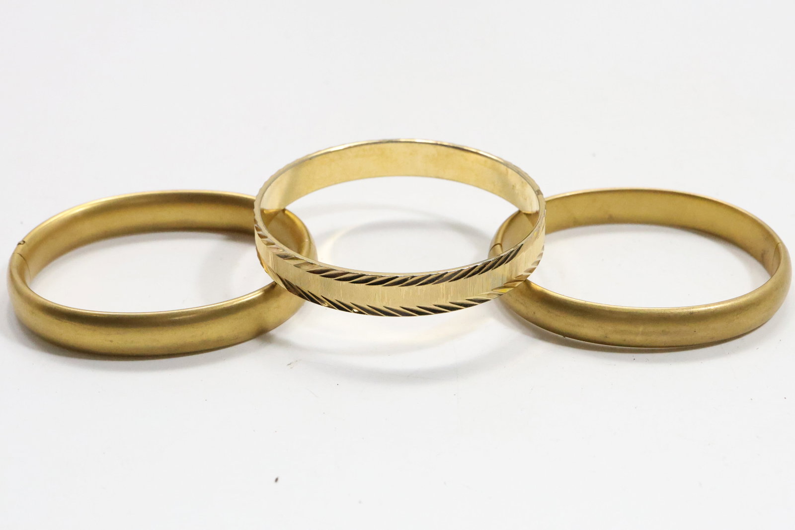 3 Assorted Bangle Bracelets: R&G Co. Golf Filled 3 in.; JFSS Gold Filled 2 3/4 in.; Monet Gold Tone (1 of 6)