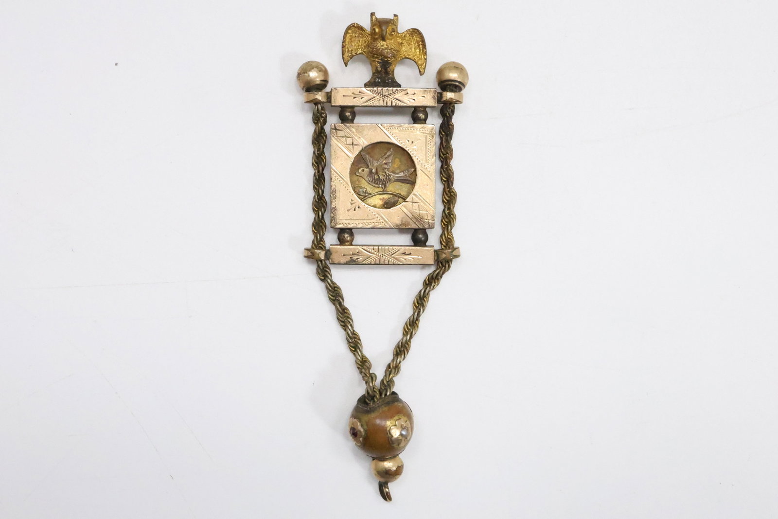 VERY RARE Gold Filled Watch Fob OWL Standing on a Picturesque of a Bird encompassed in a: VERY RARE Gold Filled Watch Fob OWL Standing on a Picturesque of a Bird encompassed in a Gold Filed Frame, Ball and Chain Adorned with Garnets and Seed Pearls. 3 1/2 in. x 1 1/4 in.