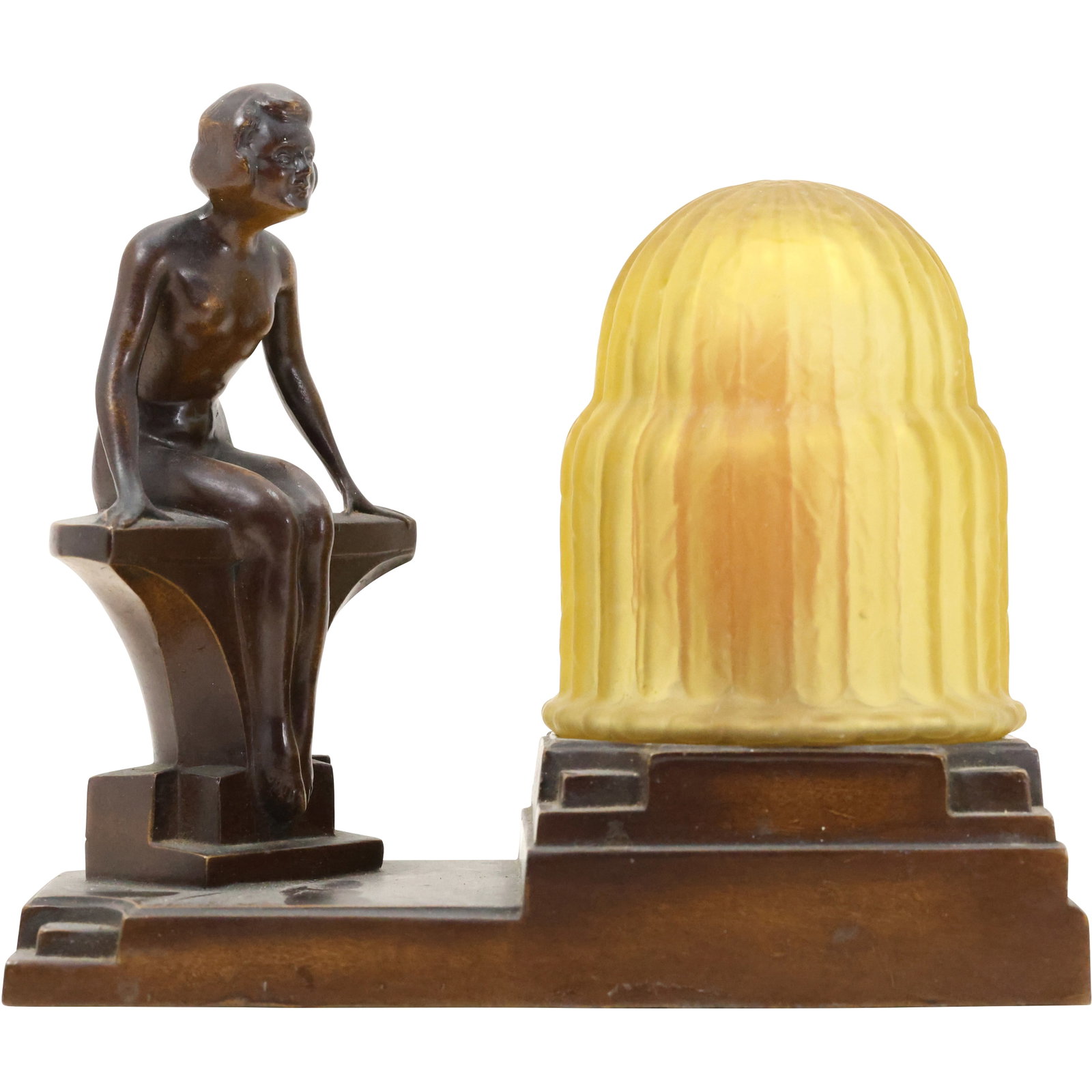 Circa 1920 NUART Creations Art Deco Nude Lamp - Cast Metal with Original Amber Glass Shade": An exquisite circa 1920 Art Deco lamp by NUART Creations, featuring a cast metal sculpture of a seated nude figure in a sleek and modern design characteristic of the era. The lamp retains its original