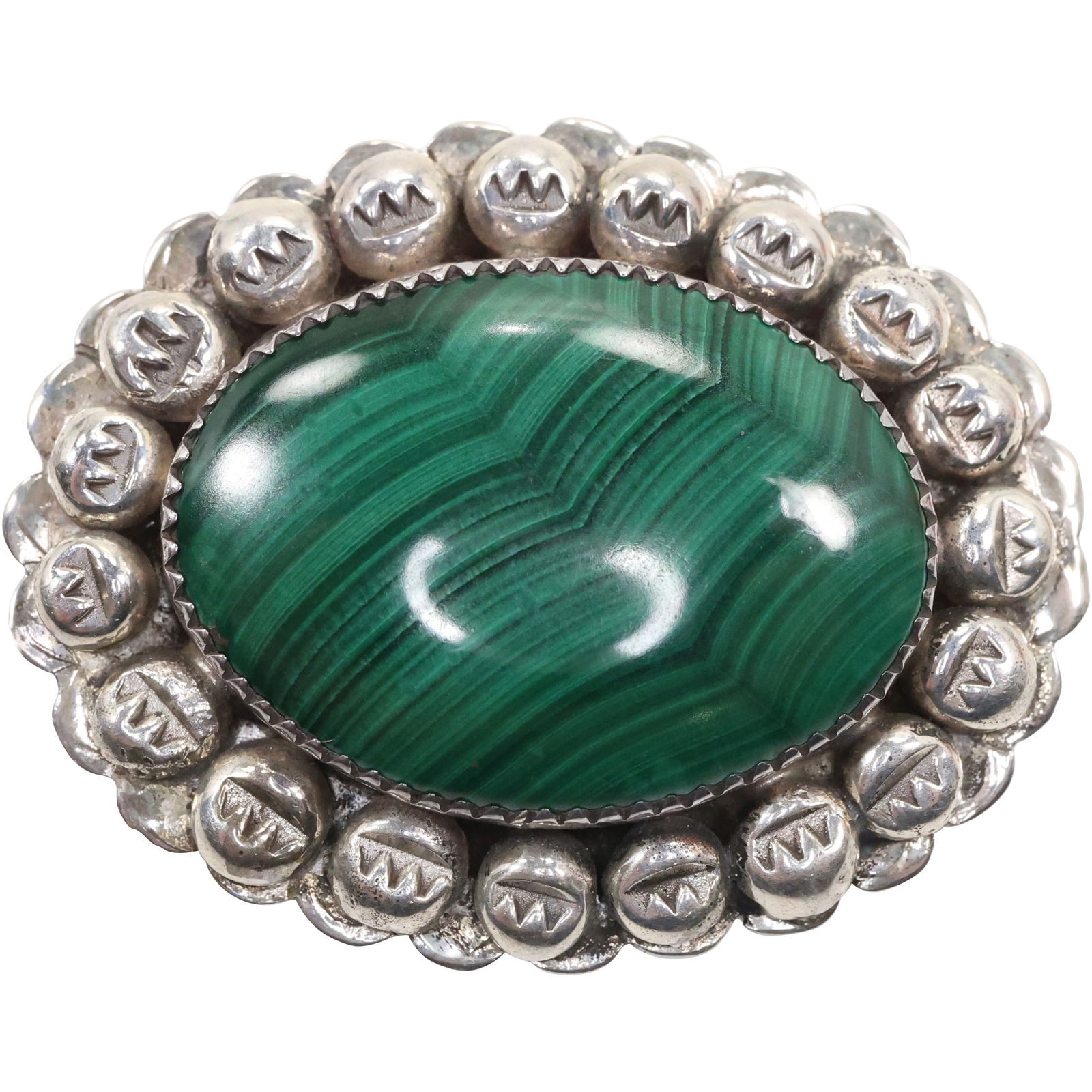 Native American Indian Navajo DO Don Platero Sterling and Malachite Pin with Symbol Beading: Native American Indian Navajo DO Don Platero Sterling and Malachite Pin with Symbol Beading surrounding Center Stone. 1 3/4 in. x 1 3/8 in.