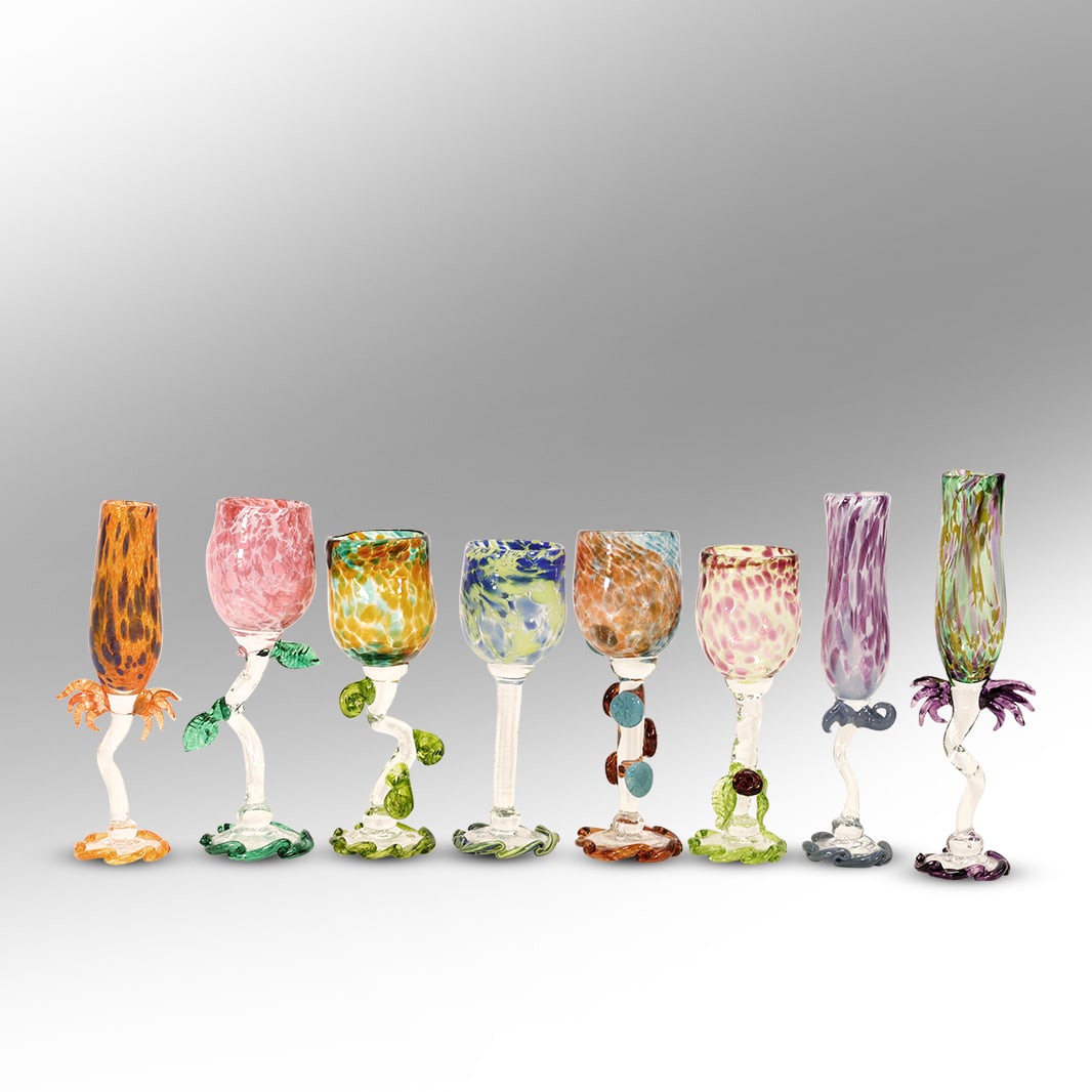 Set of 8 Signed Teri Walker, Ridgewalker Glass Gallery Hand Blown Wine and Champagne Glasses: A stunning set of 8 hand-blown artisan glasses by Teri Walker of Ridgewalker Glass Gallery, each uniquely designed with vibrant colors and sculptural embellishments. This set includes a mix of wine an