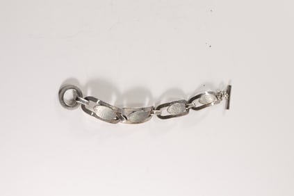 marked 800, 33.7 grams, LOA 4-Large Oval Links with Acid Etched Panels Bracelet, Toggle Closure. 7 3