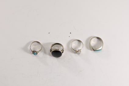 4 Assorted .925 Sterling Silver Rings: .925 A Turquoise Stone Ring size 7.25, 3/4 in. x 1/4 in.; Ste
