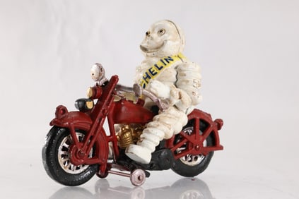Novelty Cast Iron Michelin Tire Man on a Red Cast Iron Motorcycle in Original Paint 8.5 in. length