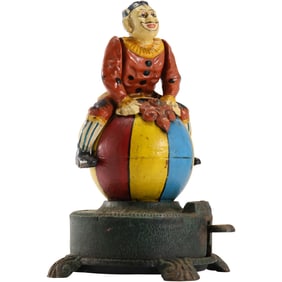 Vintage Cast Iron Spinning Clown on Globe Mechanical Coin Bank in Original Paint Finish 9.5 in. h.