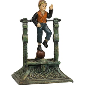 Novelty Cast Iron "Boy on Trapeze" Mechanical Bank in Original Paint Finish 8.25 in. height