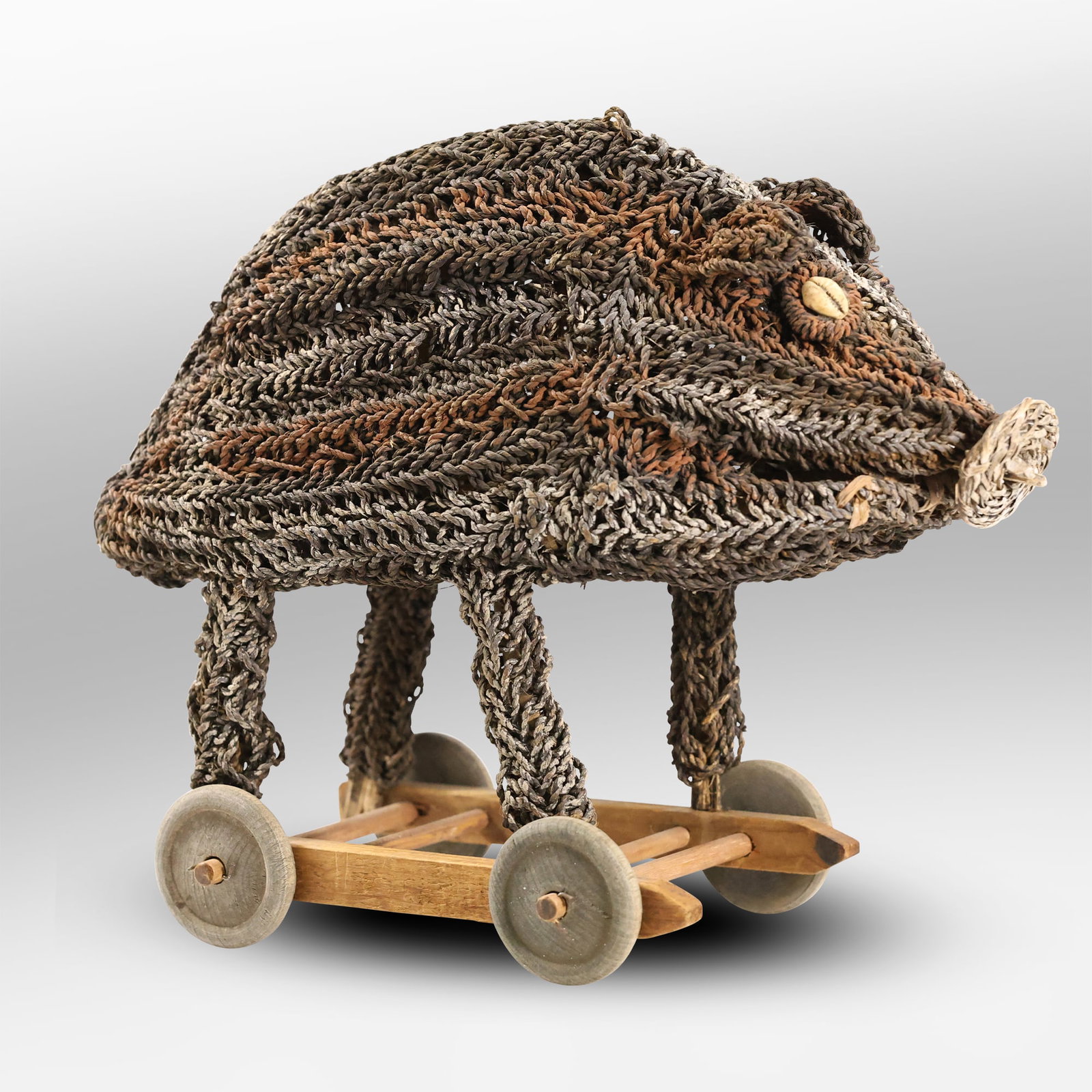 Papua New Guinea Tribal Woven Fibre Spirit Pig "Dream Vehicle" Woven Rattan, Wood Base on Wheels: Papua New Guinea Tribal Woven Fibre Spirit Pig "Dream Vehicle" Woven Rattan, Wood Base on Wheels. size: 13h 14w S:A ; Papua New Guinea Tribal Woven Fibre Spirit Pig, also known as a "dream vehicle". T