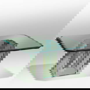 Pace International Chrome and Glass Coffee Table Designed by Leon Rosen: Pace International Chrome and Glass Coffee TableBeveled plate glass top having rounded corners and a base of chrome, corner mounts holding thick pieces of glass on each side. size: 15.5 h 32w S:strg ;