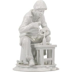 VINTAGE WHITE PORCELAIN FIGURINE OF SHOE MAKER "Cobbler" 9.5 in. height x 6.75 in. wide