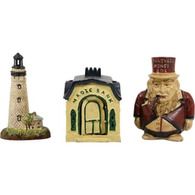 3 Assorted Novelty Cast Iron Coin Banks: Lighthouse, Ransvaal Money Box, Magic Bank