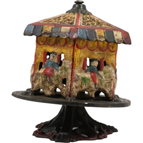 Vintage Cast Iron Spinning Carousel Merry Go Round Coin Bank in Original Paint Finish