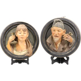 Pair Unique 19th C. Terra Cotta Round Relief Plaques of a Man, Woman Holding Candlesticks