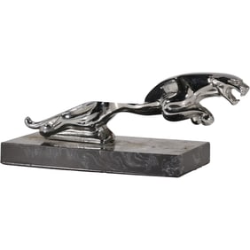 Leaping Jaguar hood ornament or mascot, commonly associated with Jaguar automobiles