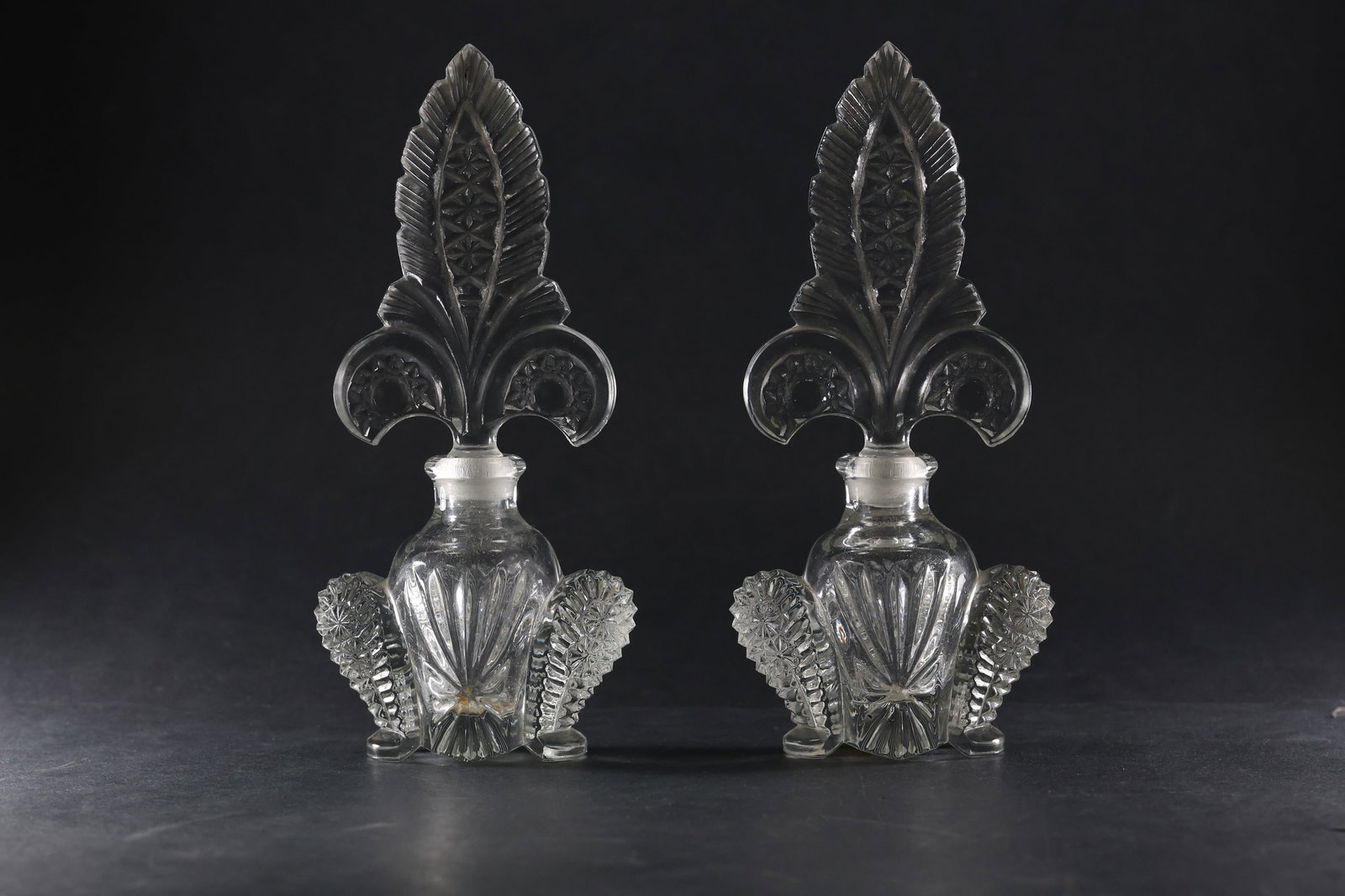 Pair ART DECO IRICE IMPERIAL GLASS FLEUR DE LIS PERFUME BOTTLES FAN TOP: Pair ART DECO IRICE IMPERIAL GLASS FLEUR DE LIS PERFUME BOTTLES FAN TOP. size: 8h 3.75w S:A