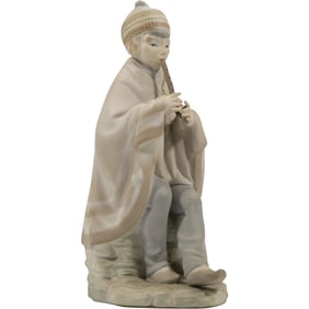 Nao by Lladro porcelain figurine of a shepherd boy playing a flute 9 in. height x 5 in. wide