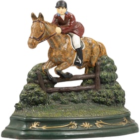 Novelty Cast Iron Doorstop featuring a Jockey on a Horse Jumping over a Fence 11.5 in. height