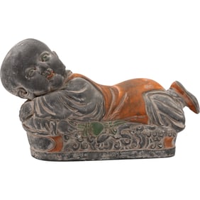antique Chinese ceramic opium pillow, also known as a headrest, depicting a boy