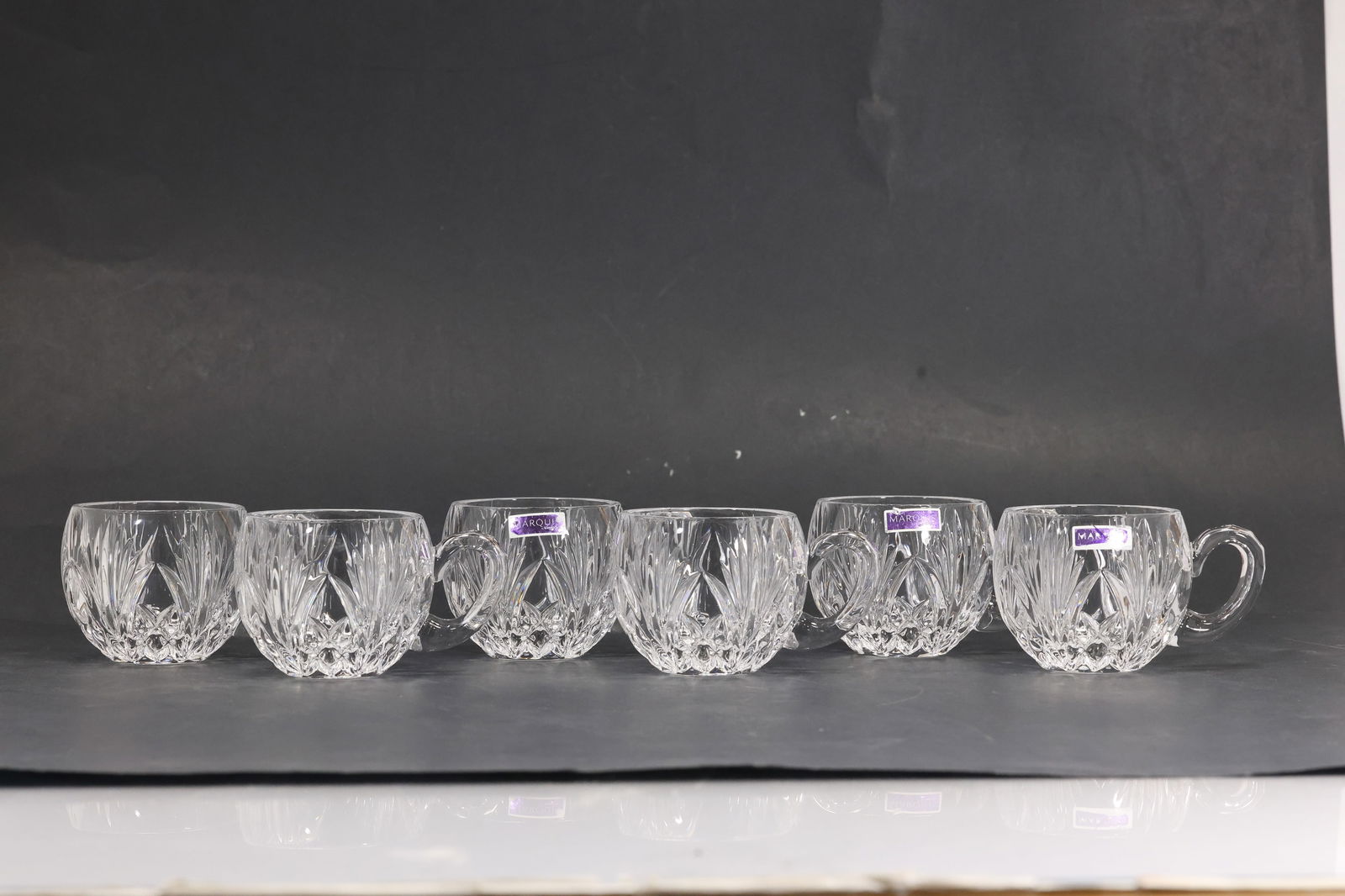 Set of 6 Marquis Waterford Crystal Glass Tea Cups with Original Labels: Set of six crystal glass cups by Marquis Waterford. Each cup is cut in a faceted pattern that reflects light beautifully and retains the original Waterford labels. These cups are ideal for entertainin