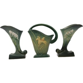 three pieces of Roseville Zephyr Lily art pottery, including two cornucopia vases, handled basket
