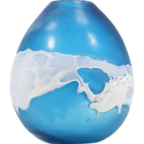 hand-blown glass vase featuring a blue base with a white, wave-like pattern 10 in. height x 8 in.