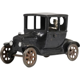 1920s vintage cast iron toy car, specifically an Arcade Manufacturing Company Ford Model T Coupe