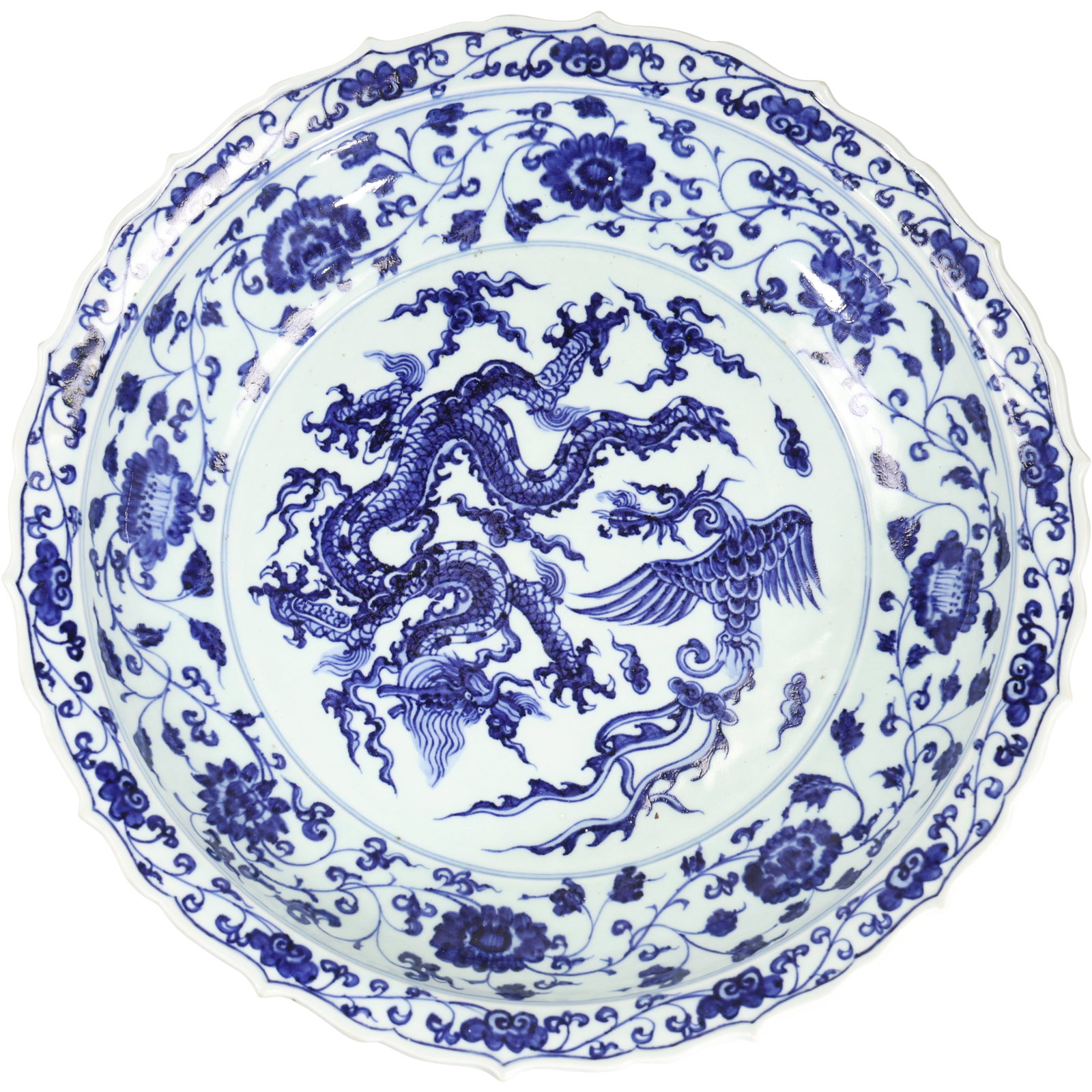 Chinese blue and white porcelain charger plate, with a dragon and phoenix design 16 in. diameter: Chinese blue and white porcelain plate, also known as a charger plate, with a dragon and phoenix design.The plate is decorated with a hand-painted cobalt blue design on a white porcelain background. T