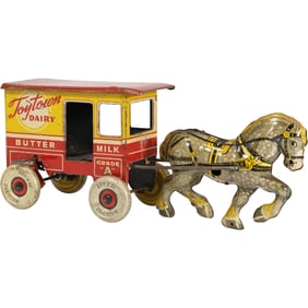 vintage Marx Toytown Dairy horse-drawn wagon, a tin lithographed wind-up toy. 10 in. length